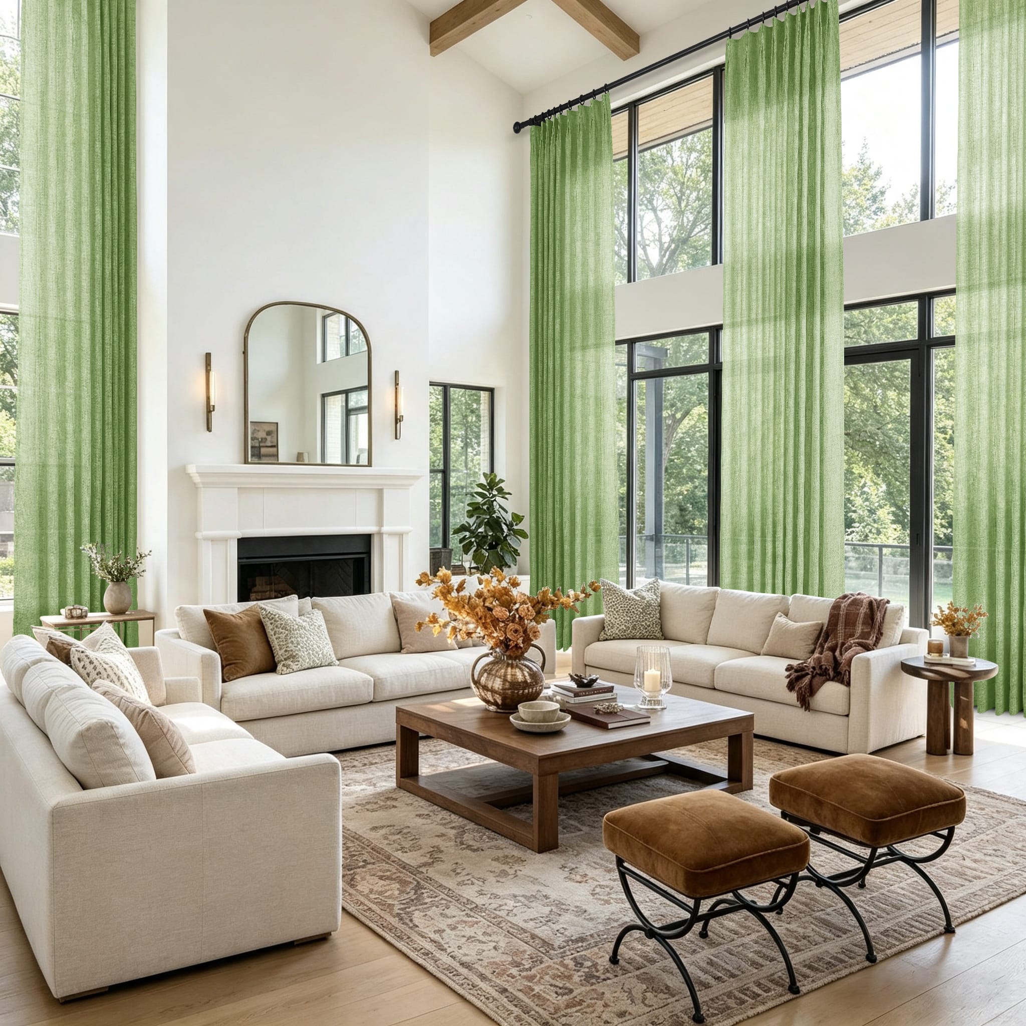 A bright modern living room with tall green curtains and a large patterned area rug showing a view of trees outside the windows