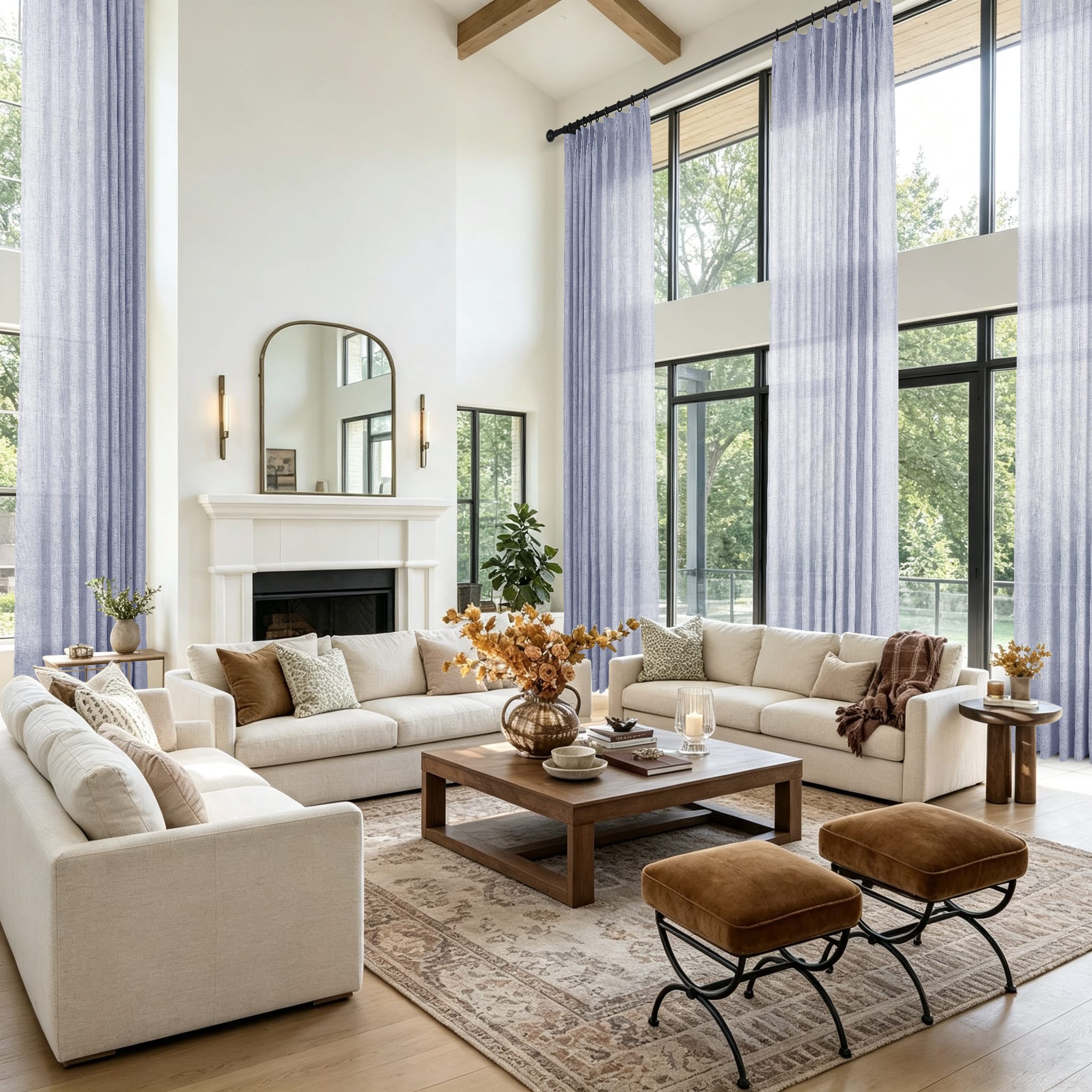 A bright modern living room with tall windows and floor to ceiling light lavender curtains